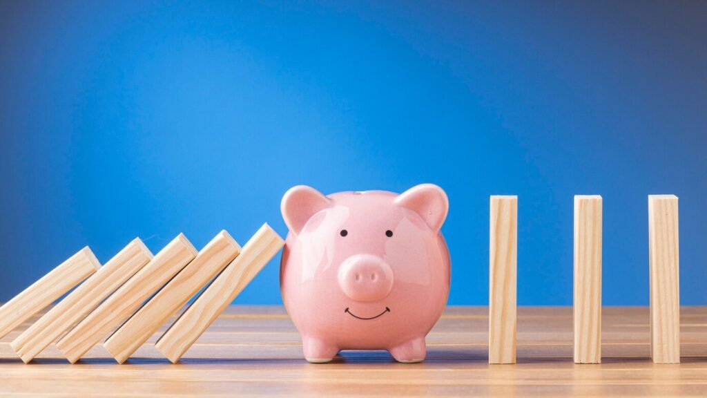piggy-bank-with-wooden-pieces-arrangement_23-2148783072