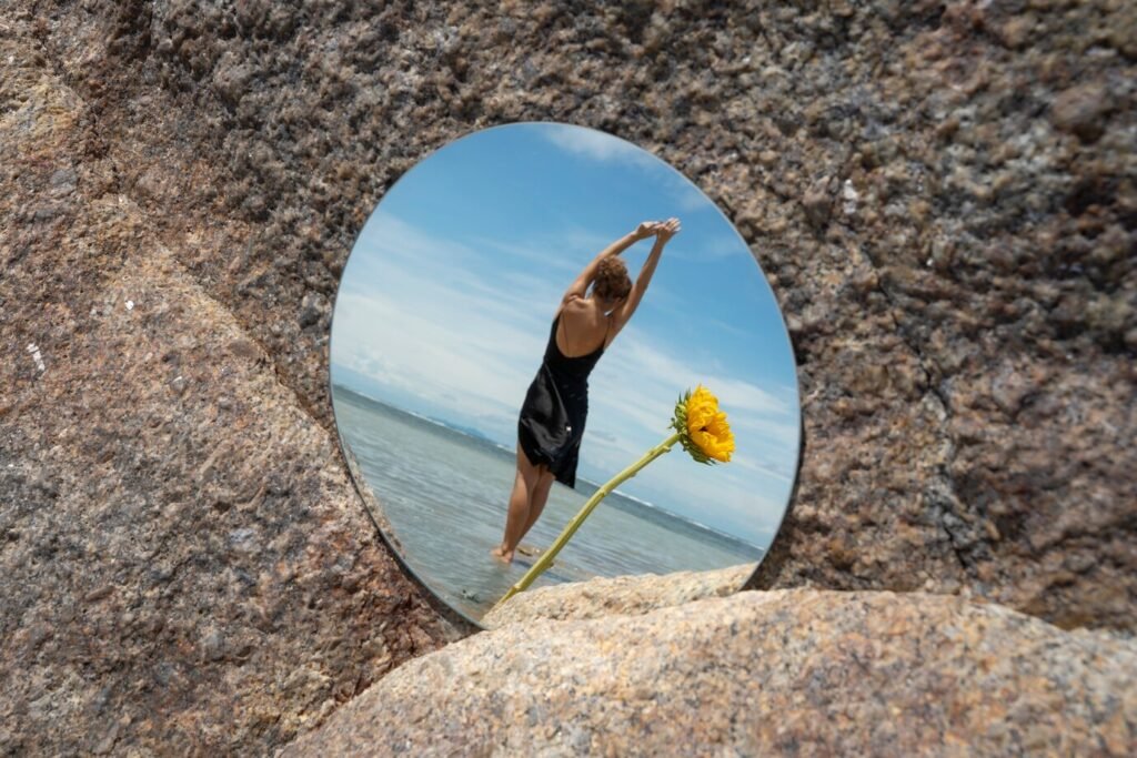 woman-posing-with-round-mirror-flower_23-2149574197